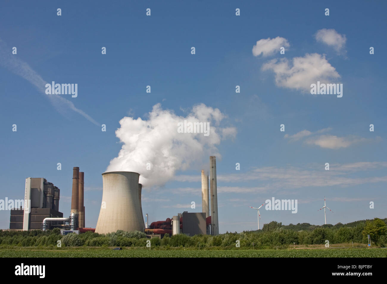 smoky power plant with blue sky Stock Photo