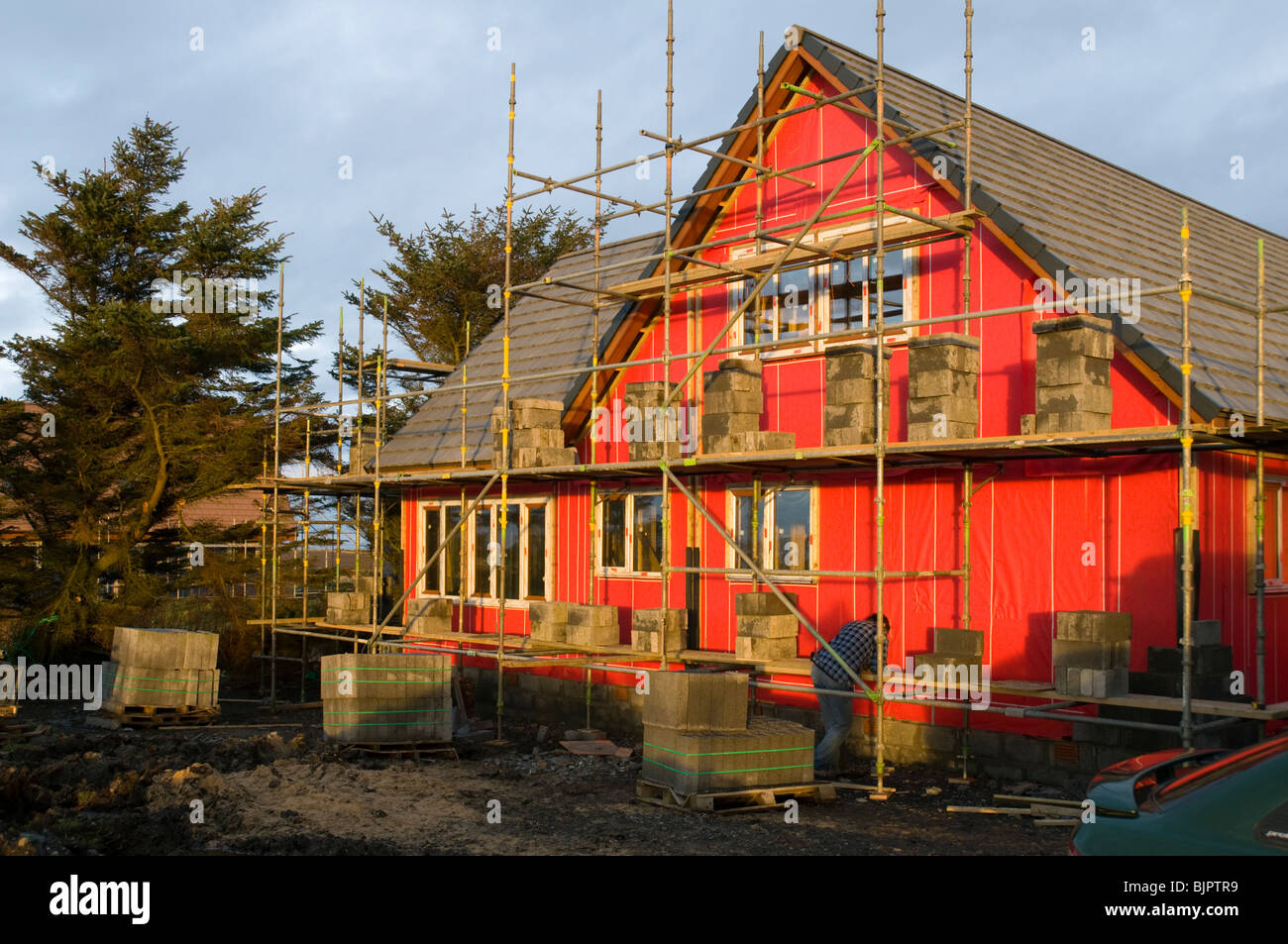 Exterior of a timber framed house under construction in the village of