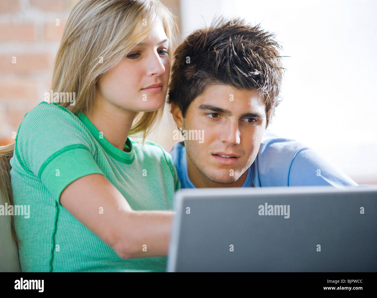 Couple at laptop Stock Photo - Alamy