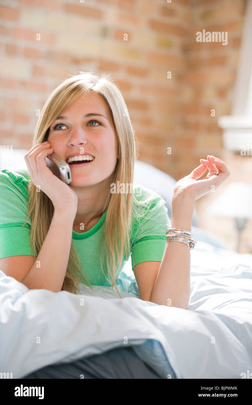 Woman dialing cell phone Stock Photo