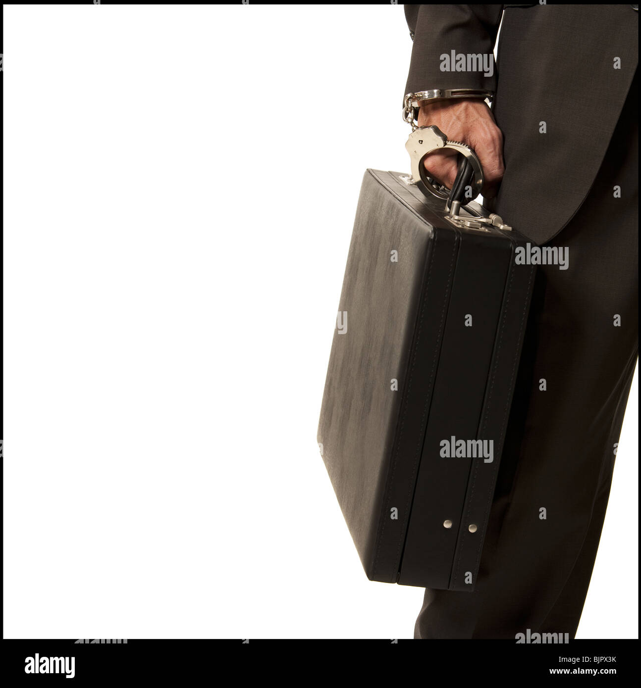 Businessman handcuffed to a briefcase Stock Photo Alamy