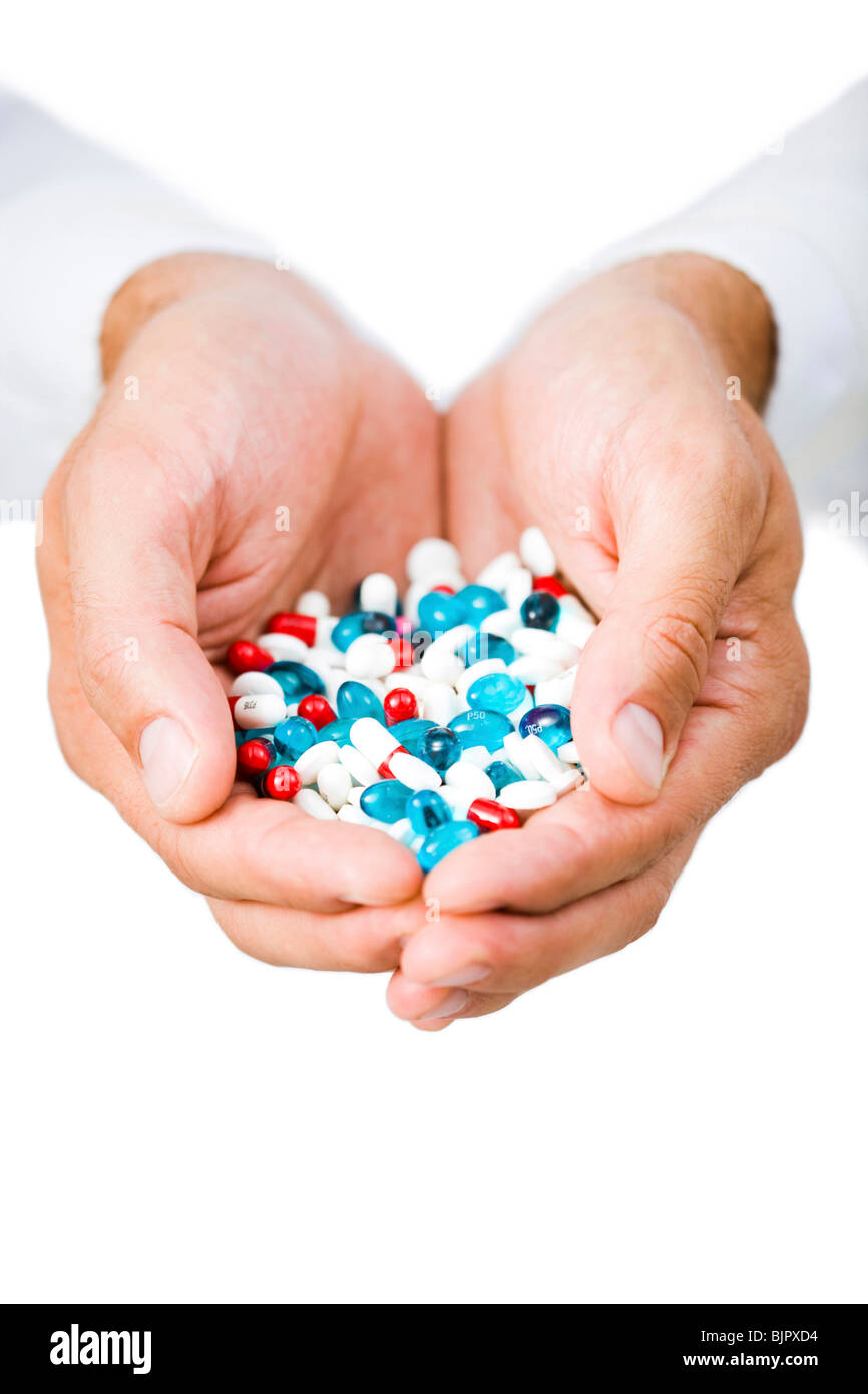 Hands holding pills Stock Photo Alamy