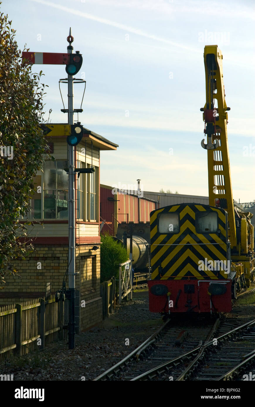 Shunting loco, signal box , signal and Cowans Sheldon 50 tonne strut jib rail crane at Crewe, Cheshire, UK Stock Photo