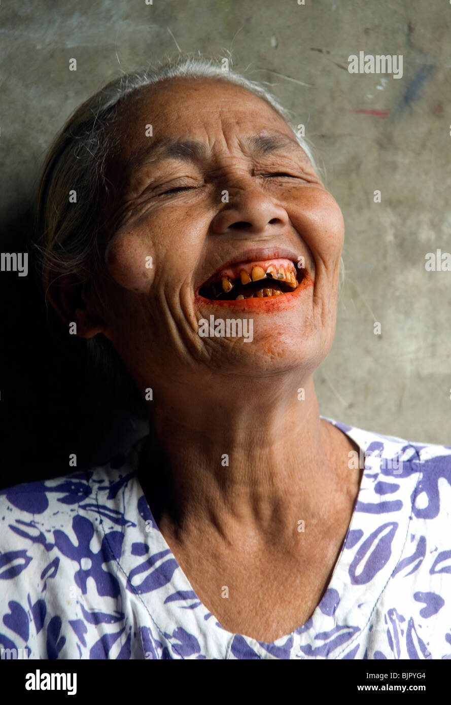 The betelnut stained smiles of a Batak woman Stock Photo