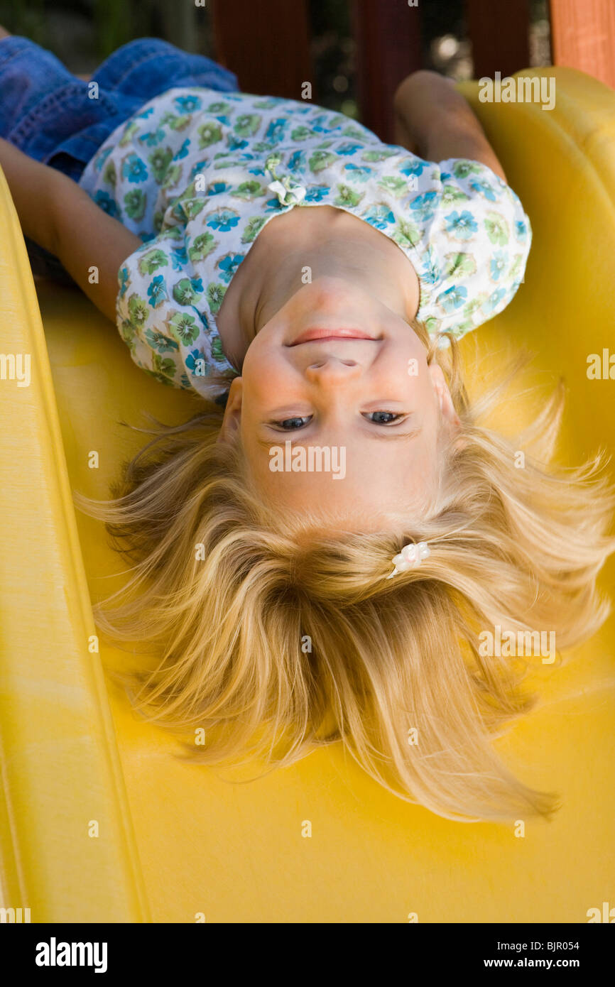 Girl on slide Stock Photo Alamy