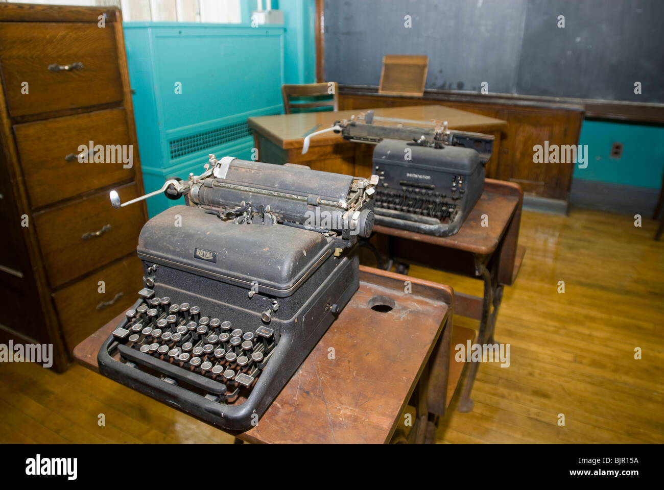 Old manual typewriters are seen in an unused classroom in a school in