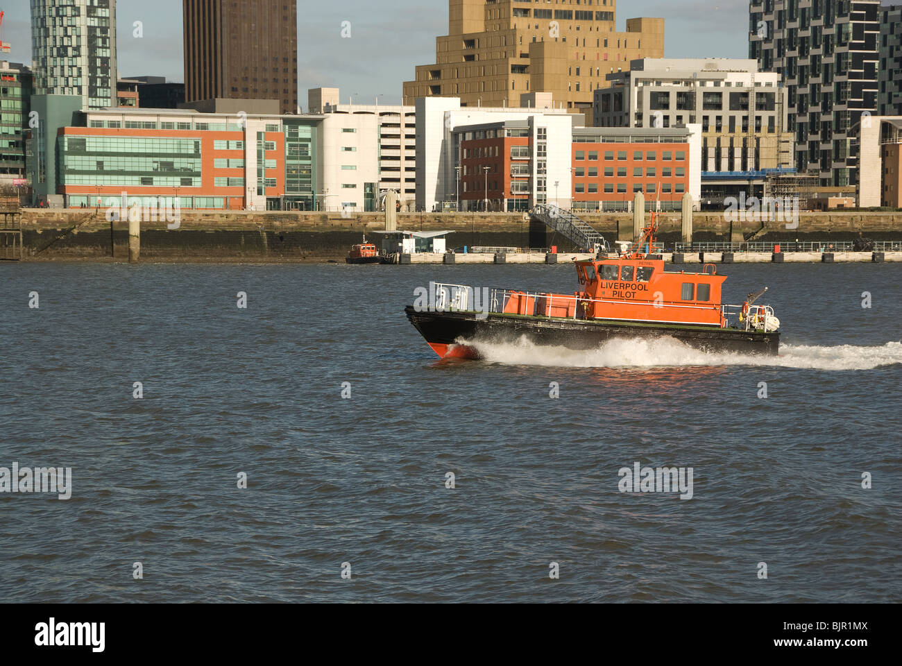Liverpool pilot vessel speeding across Waterfront Stock Photo