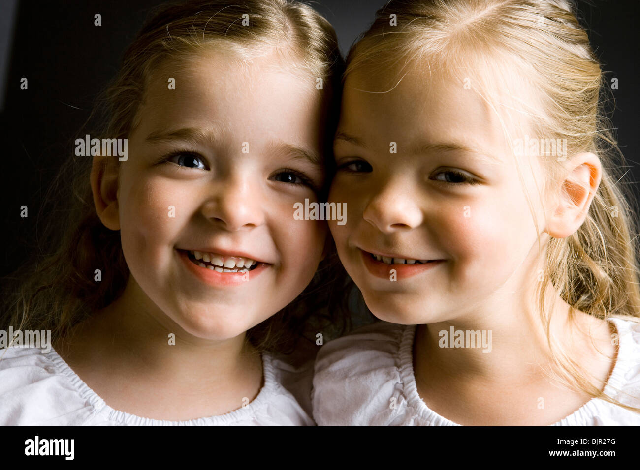 Two Girls Smiling Stock Photo Alamy