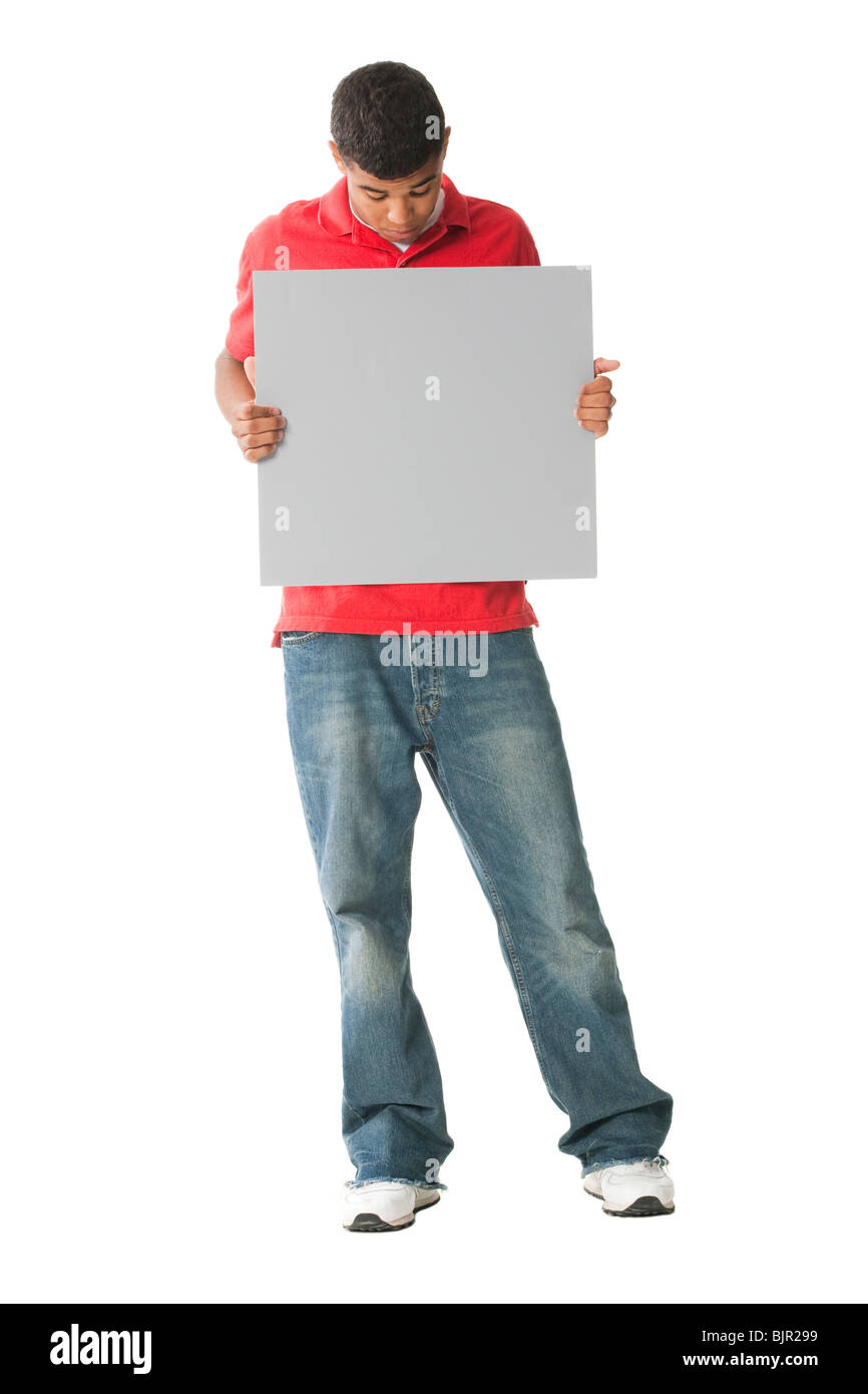 Teenage boy with blank sign Stock Photo - Alamy