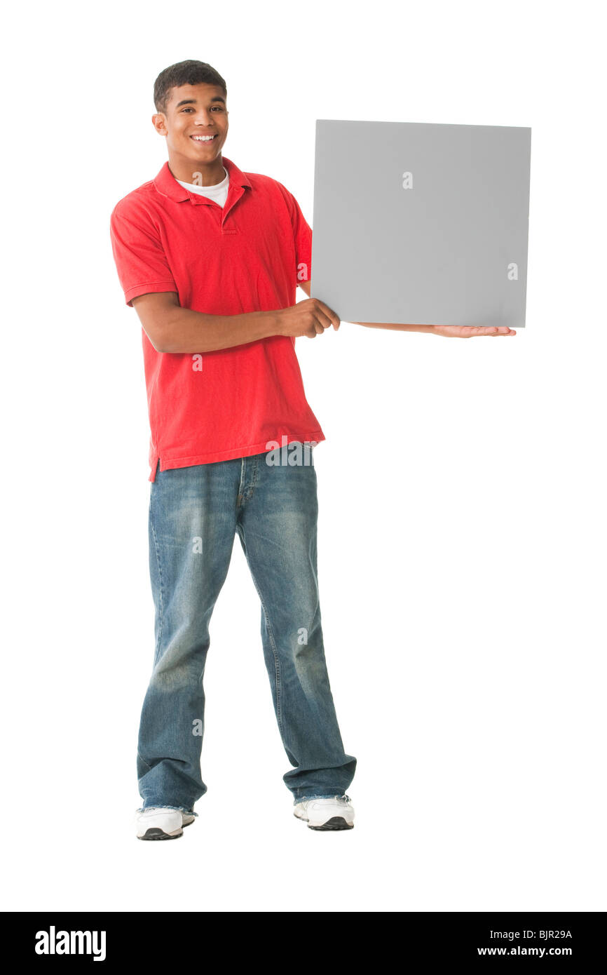 Teenage boy with blank sign Stock Photo - Alamy
