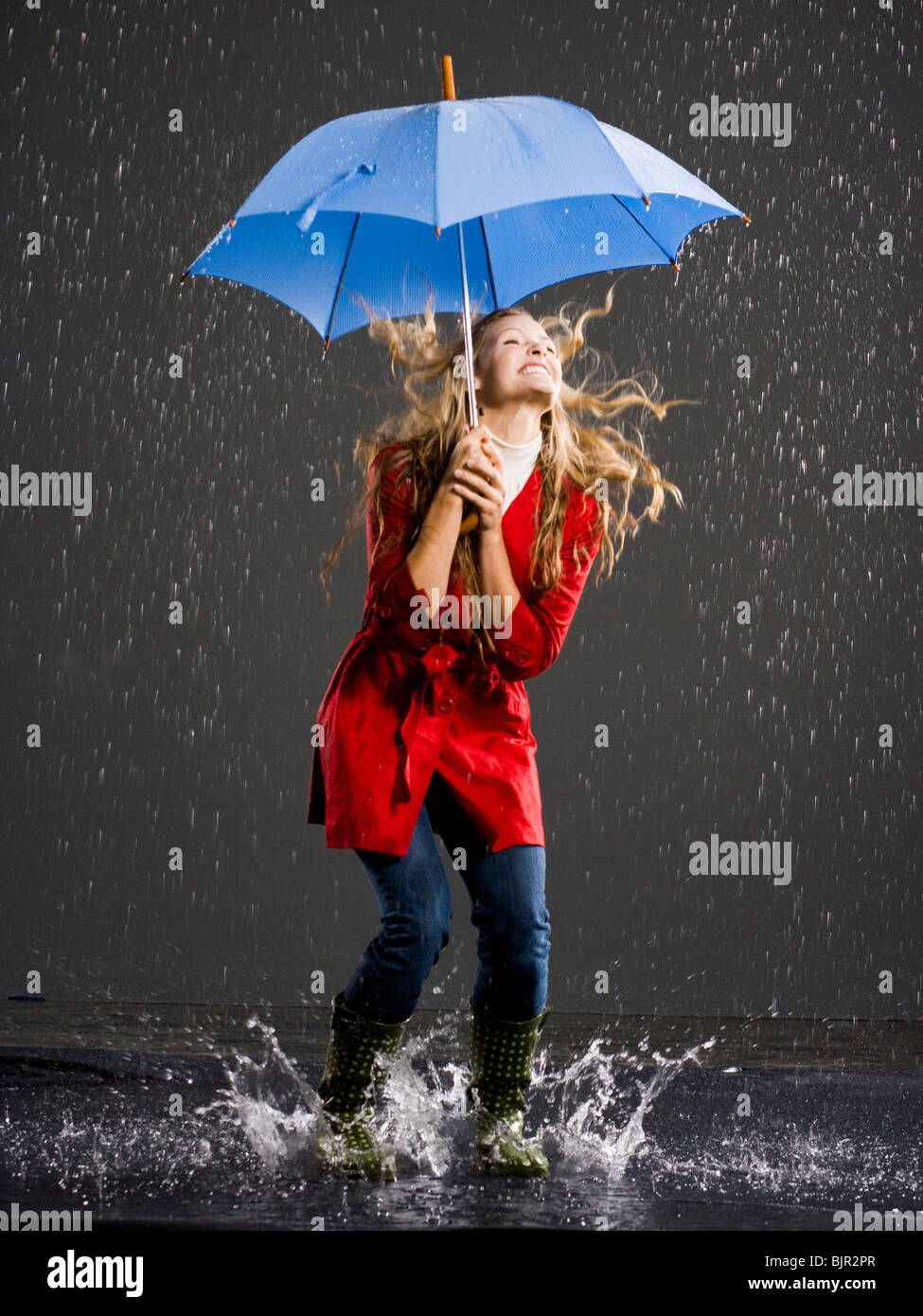 Young woman with an umbrella Stock Photo - Alamy