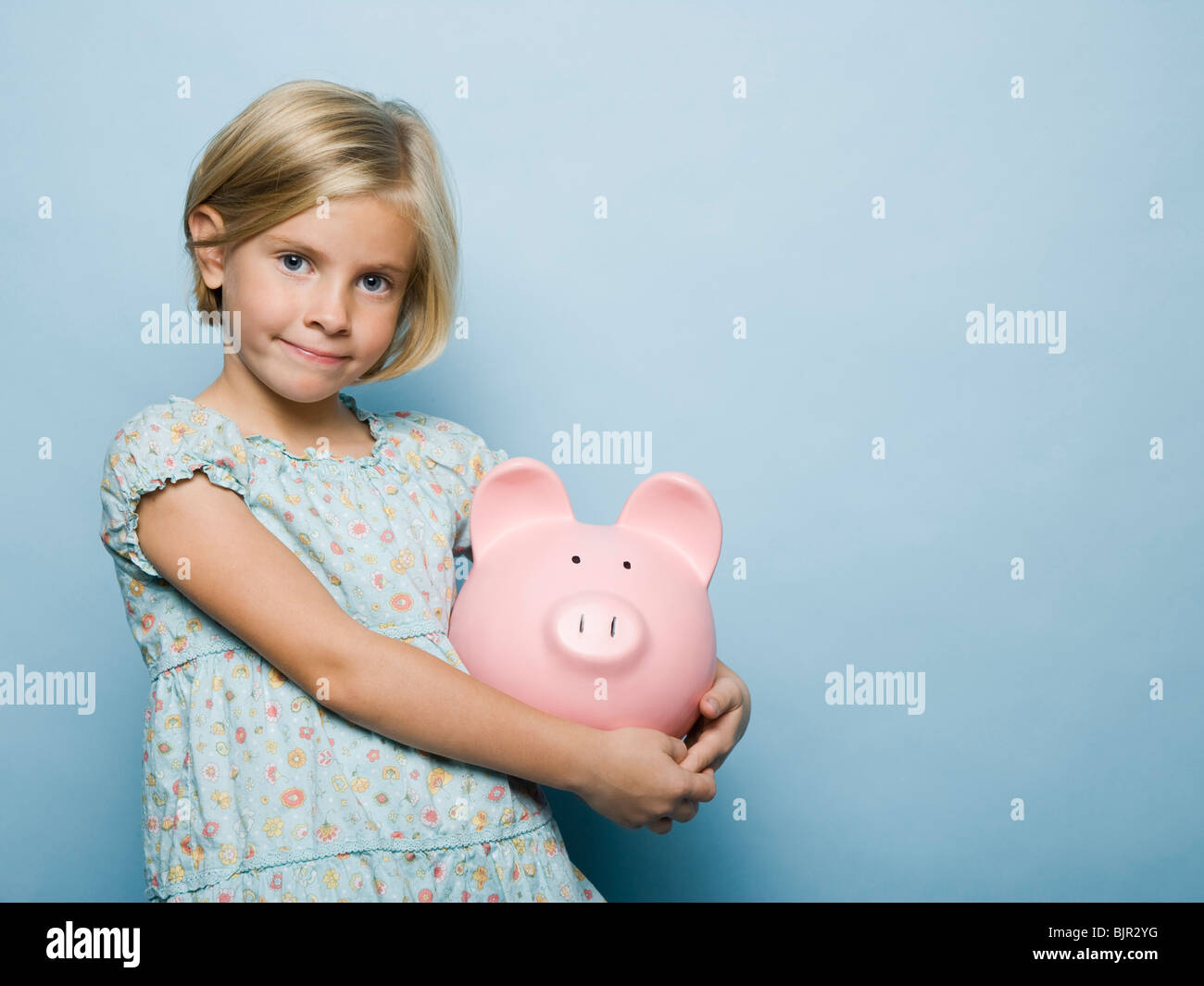girl with a piggy bank Stock Photo - Alamy