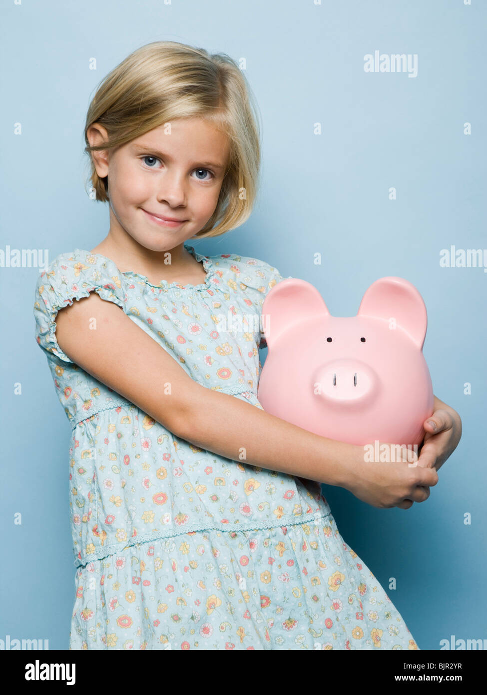 Girl 7 with piggy bank hi-res stock photography and images - Alamy