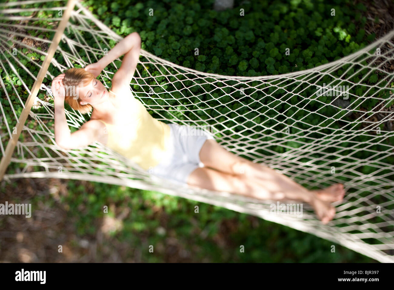 Woman sleeping in a hammock Stock Photo
