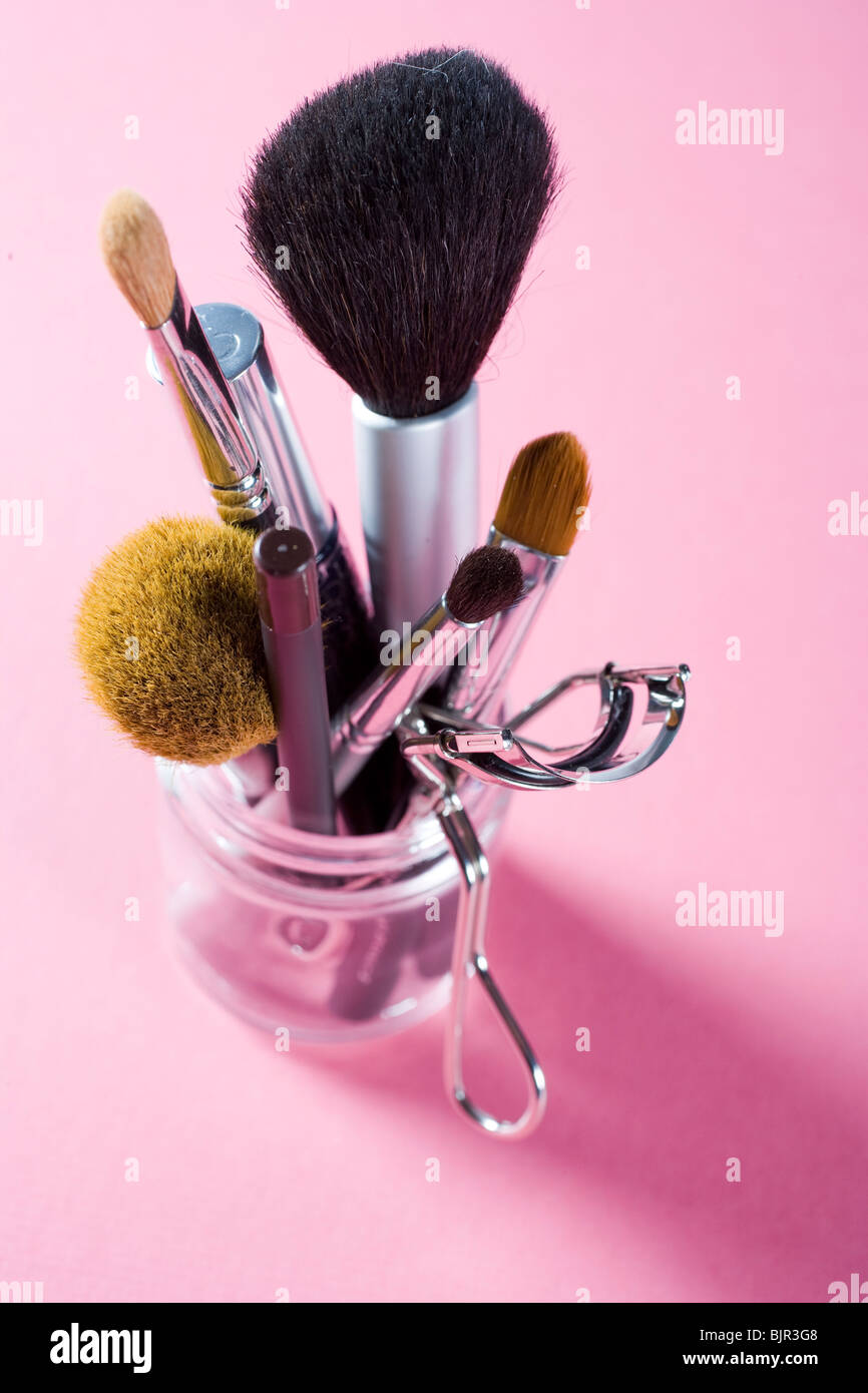 Assorted makeup brushes and cosmetics instruments. Stock Photo