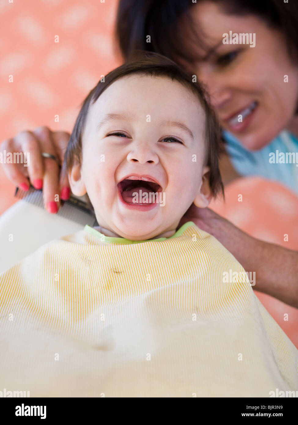 Baby getting a haircut Stock Photo Alamy