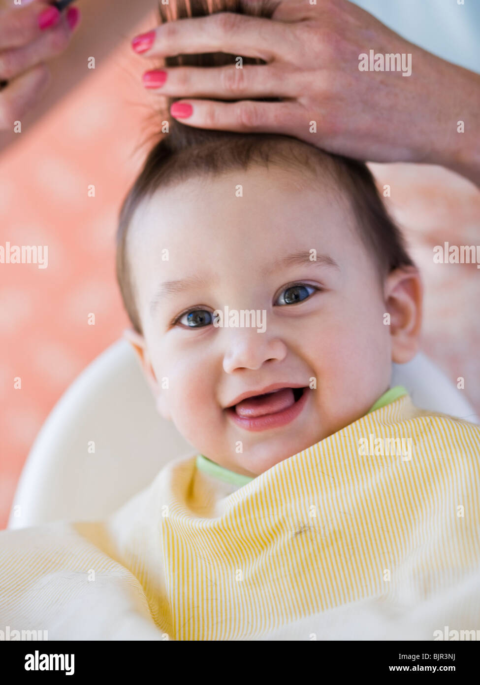 Baby getting a haircut Stock Photo Alamy