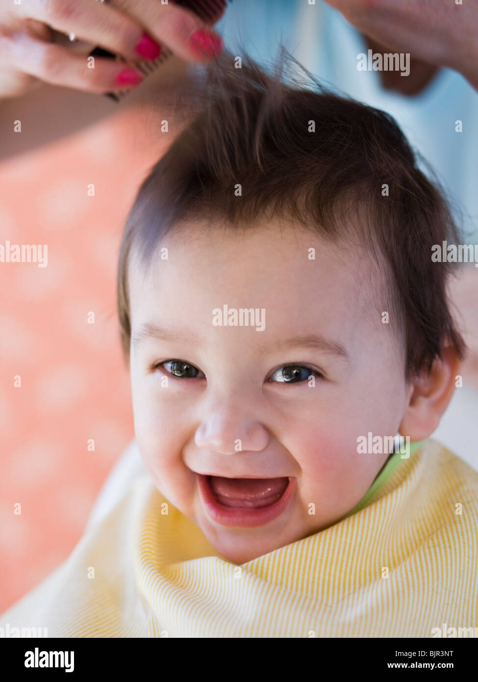 Baby getting a haircut Stock Photo Alamy