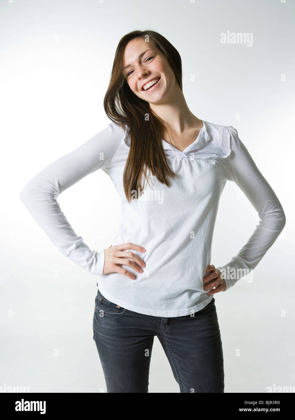 young woman with a white shirt, smiling. Stock Photo