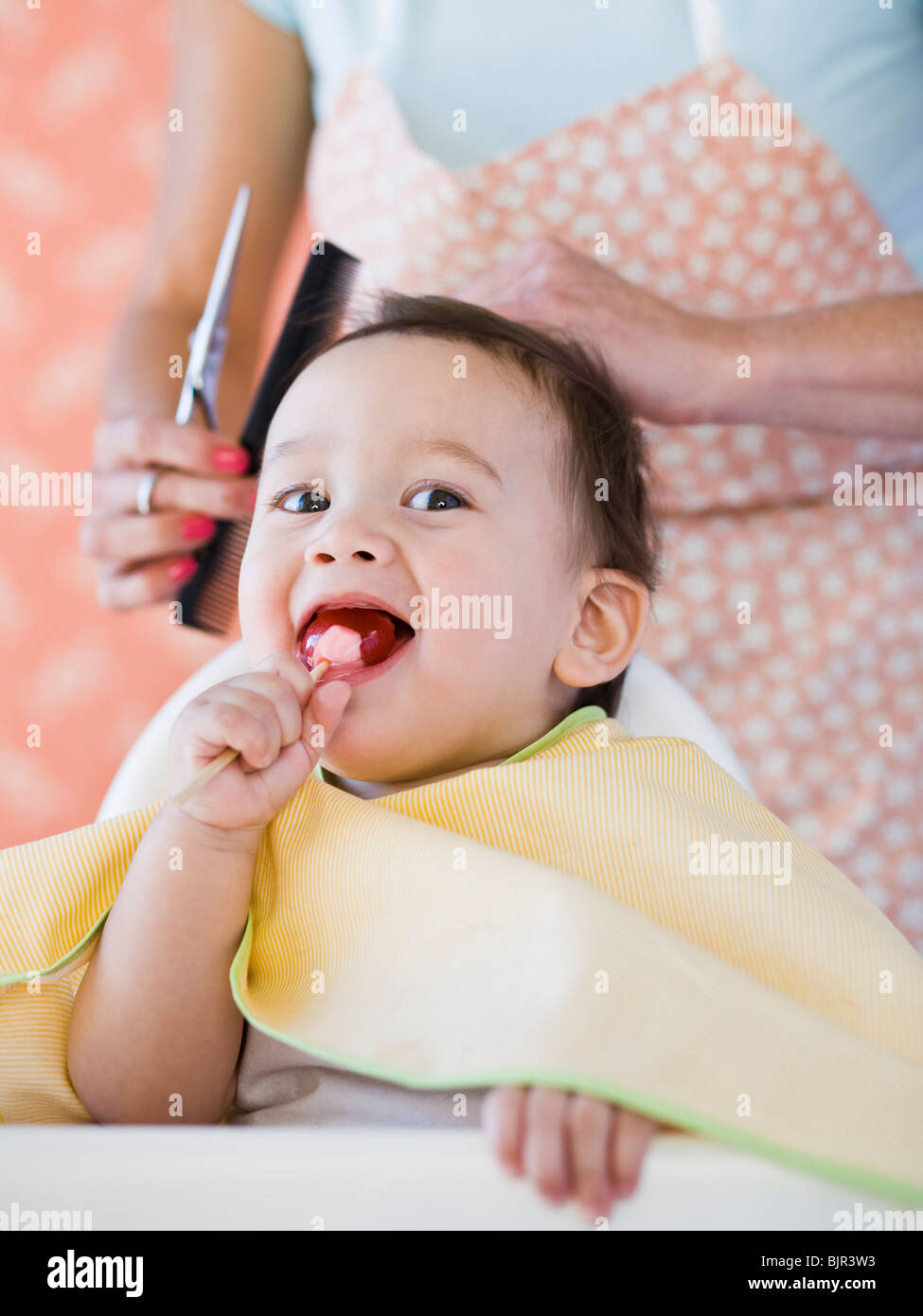 Baby getting a haircut Stock Photo Alamy