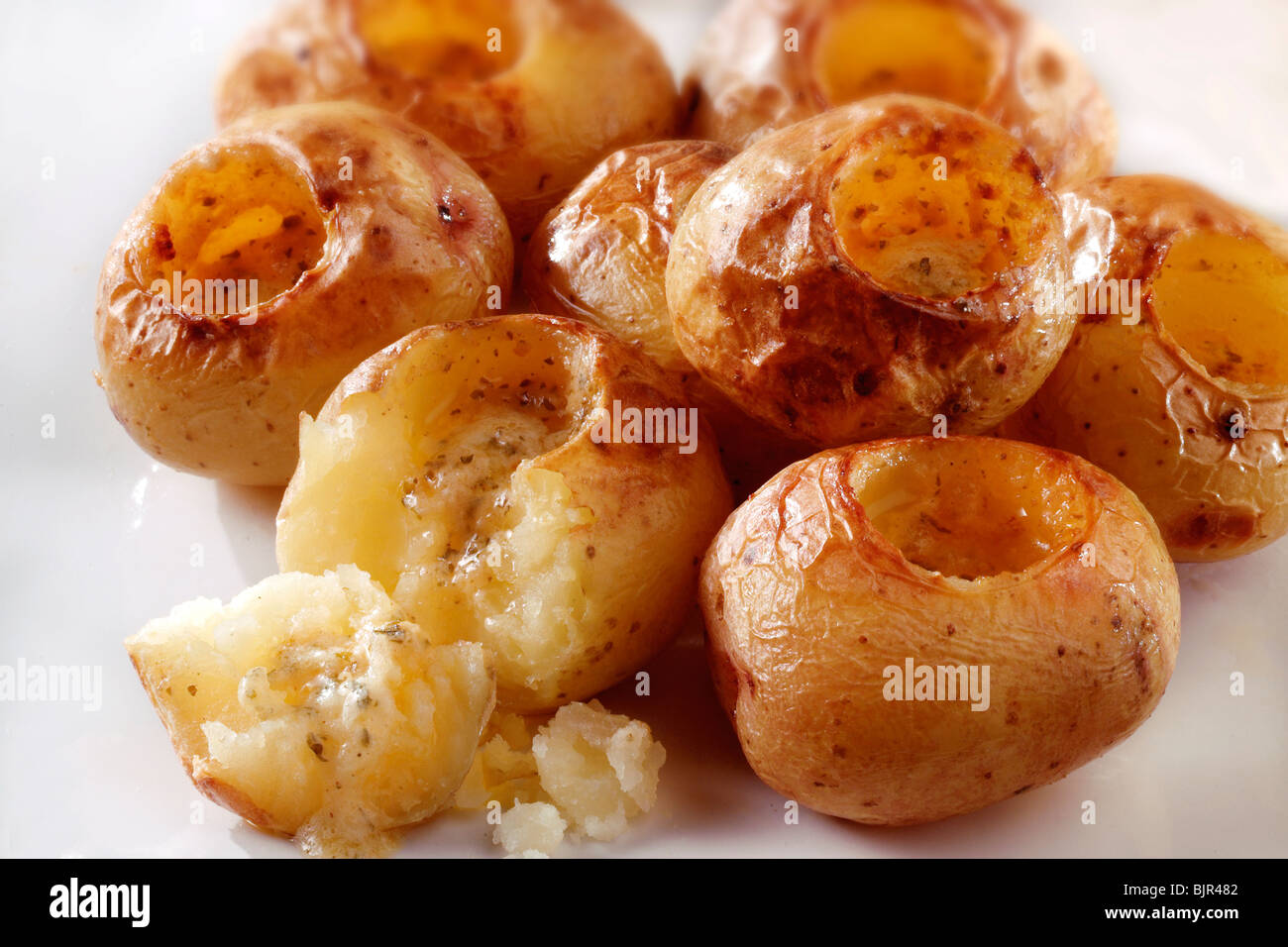 roast new potatoes with herby butter food photos Stock Photo
