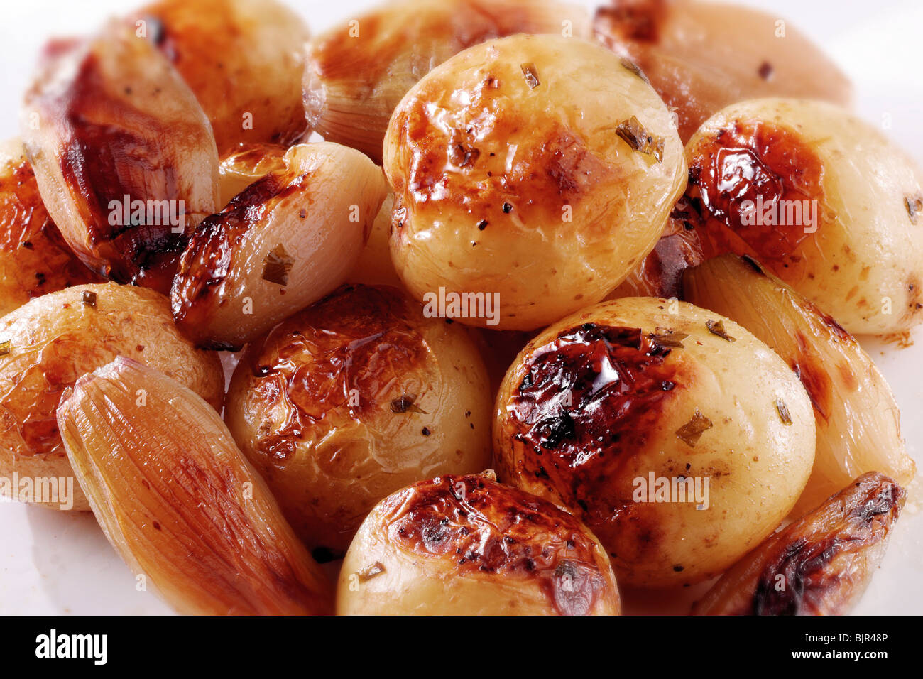 Roast potatoes in their skins and onions food photos Stock Photo