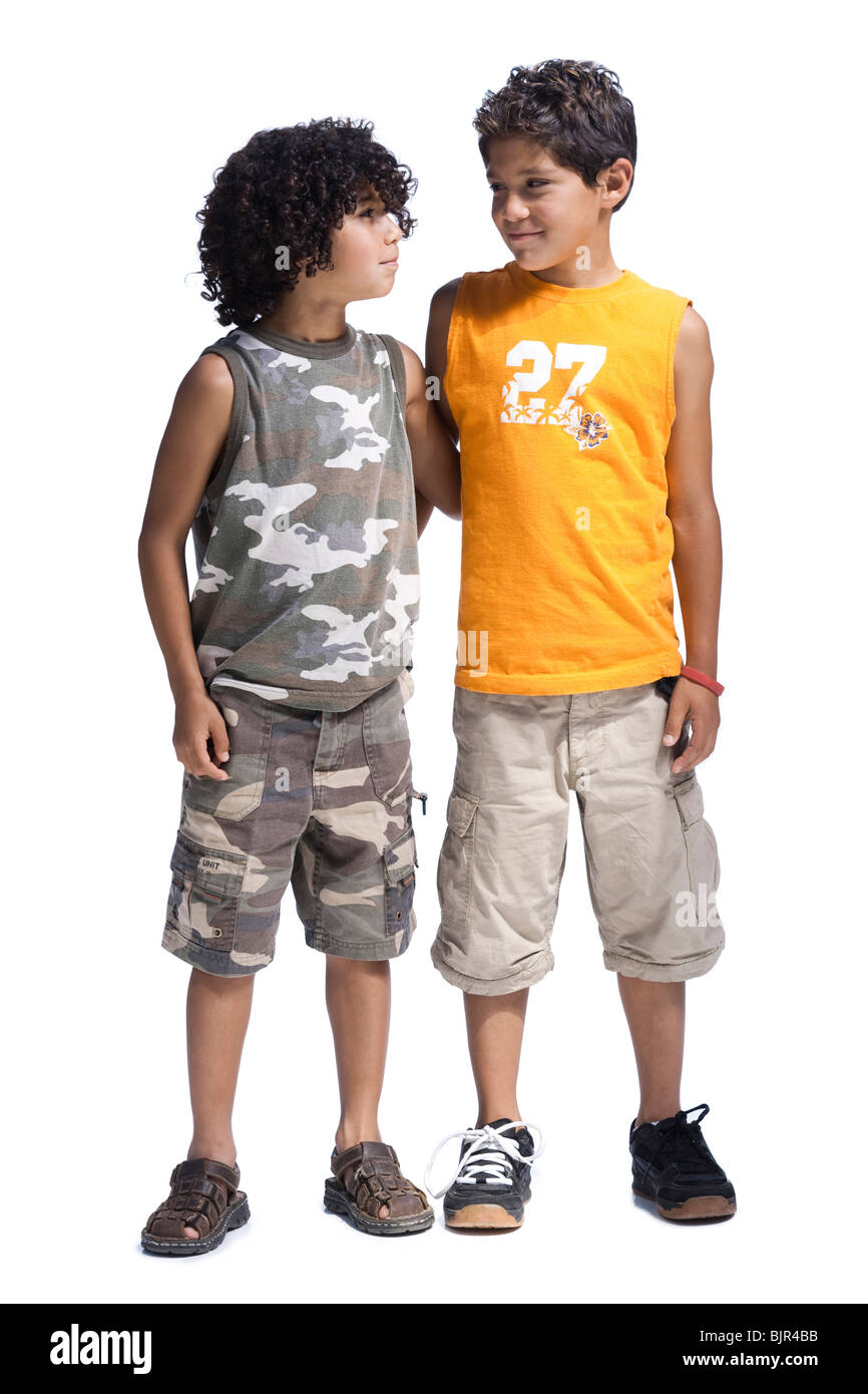 Two boys standing together Stock Photo - Alamy