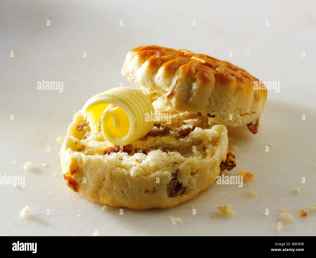 Traditional raison scone and butter Stock Photo