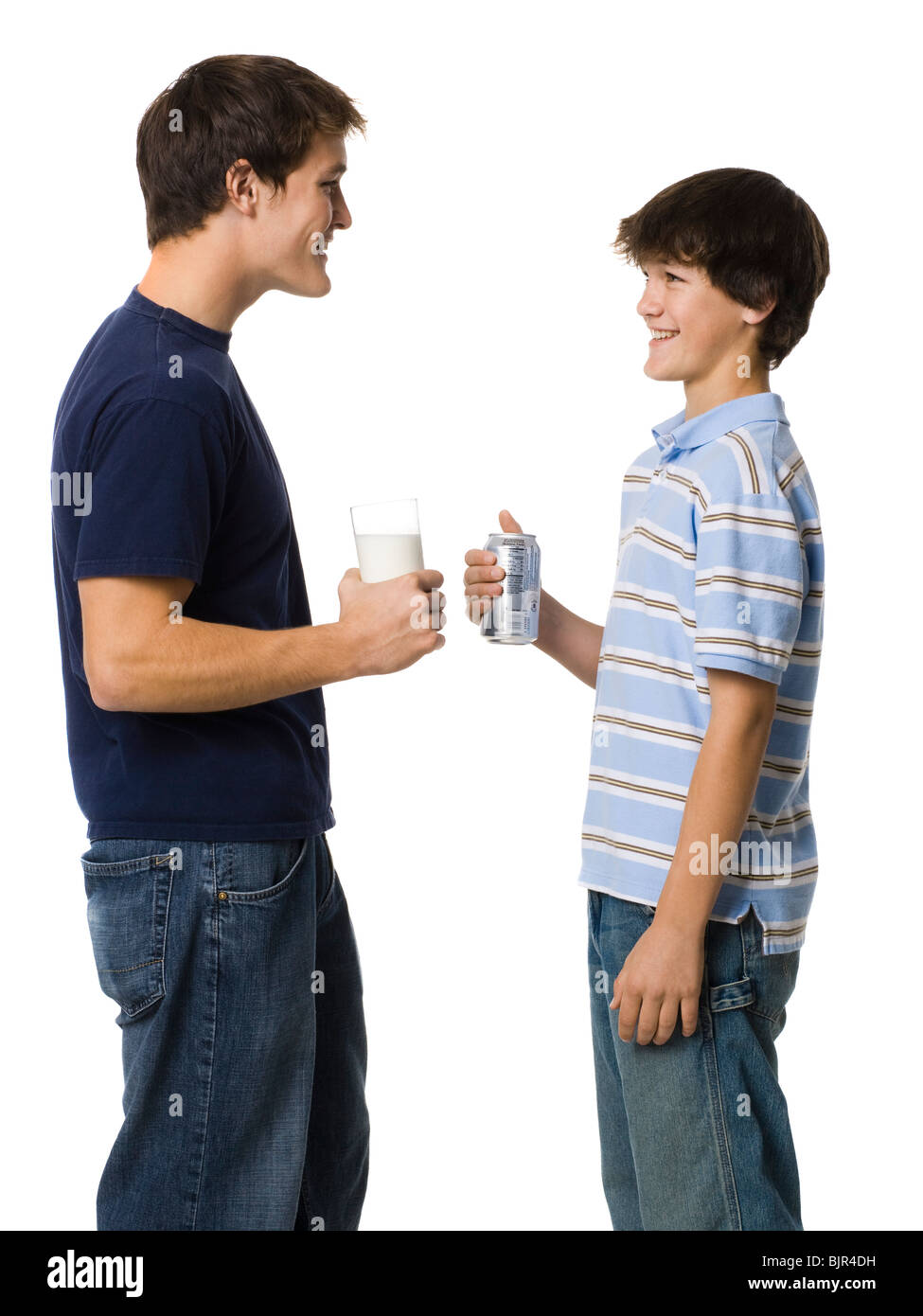 two young men drinking milk and soda Stock Photo Alamy