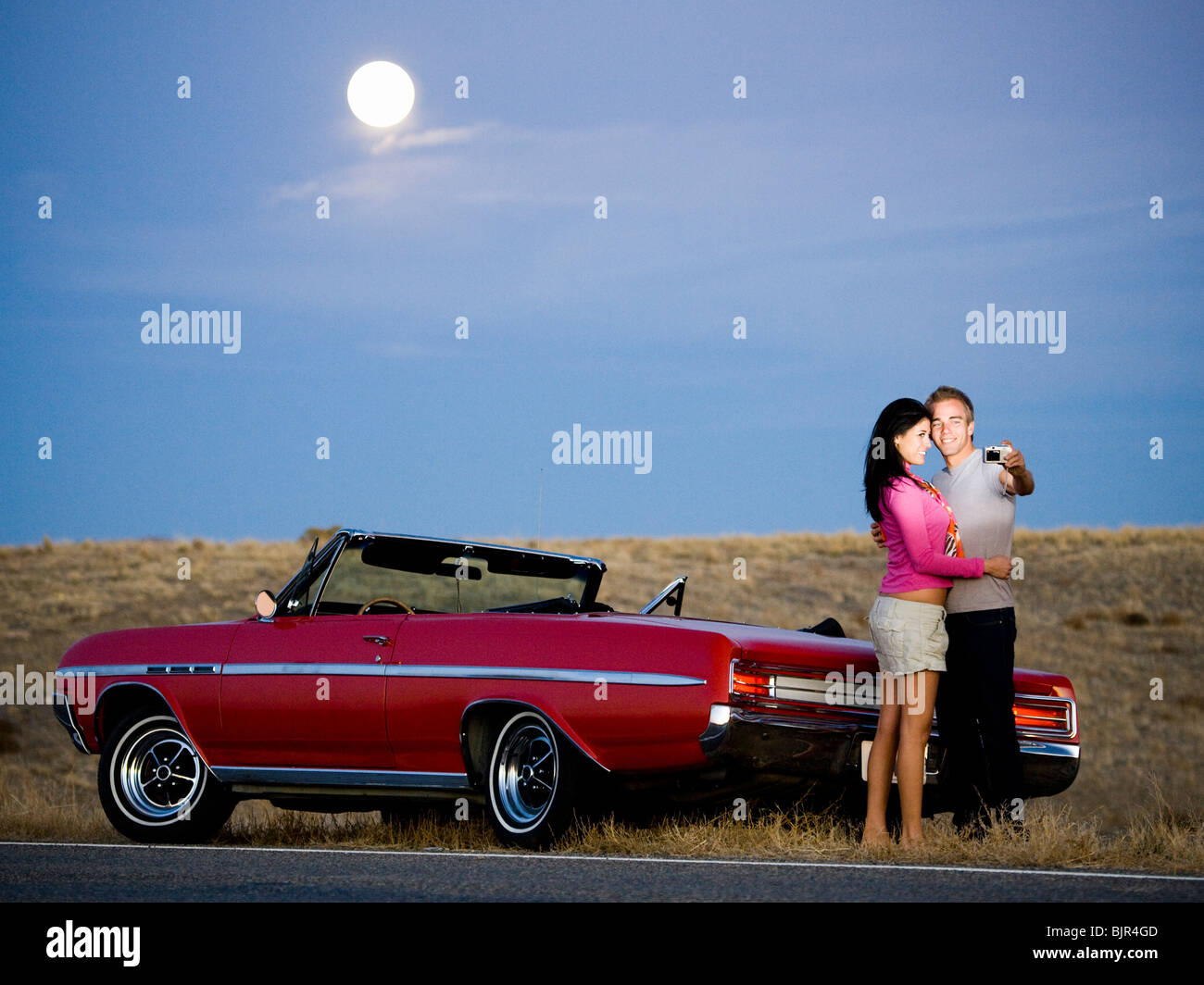 couple under a full moon Stock Photo - Alamy