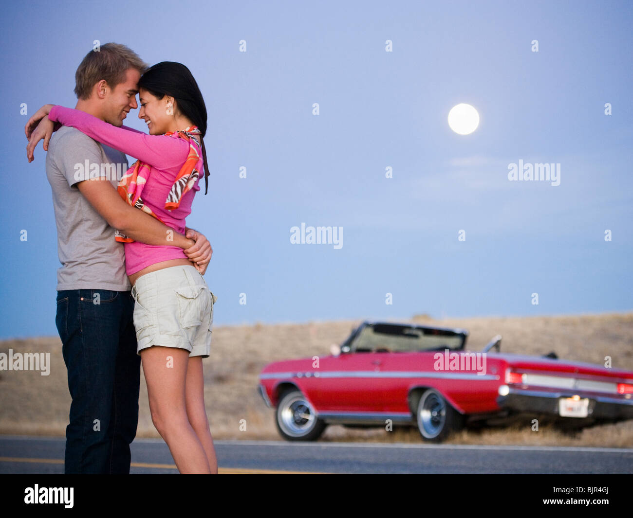 couple under a full moon Stock Photo - Alamy
