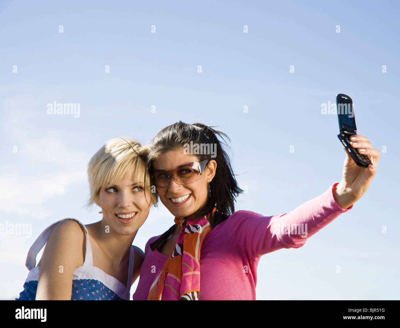 two women taking a photo Stock Photo