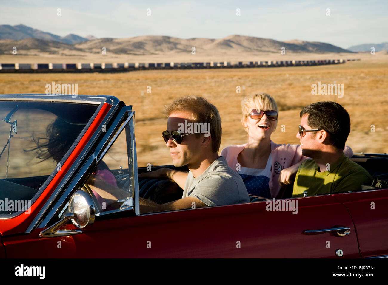 four people on a road trip Stock Photo