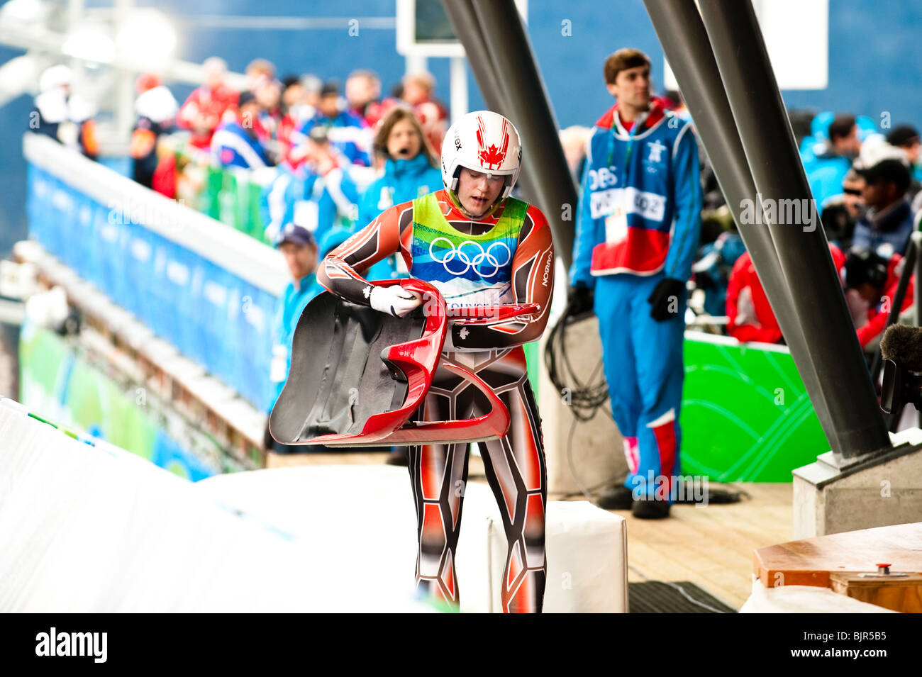 This is an image of a Canadian womens luge athlete cross the finish at the 2010 Olympic winter games. Stock Photo
