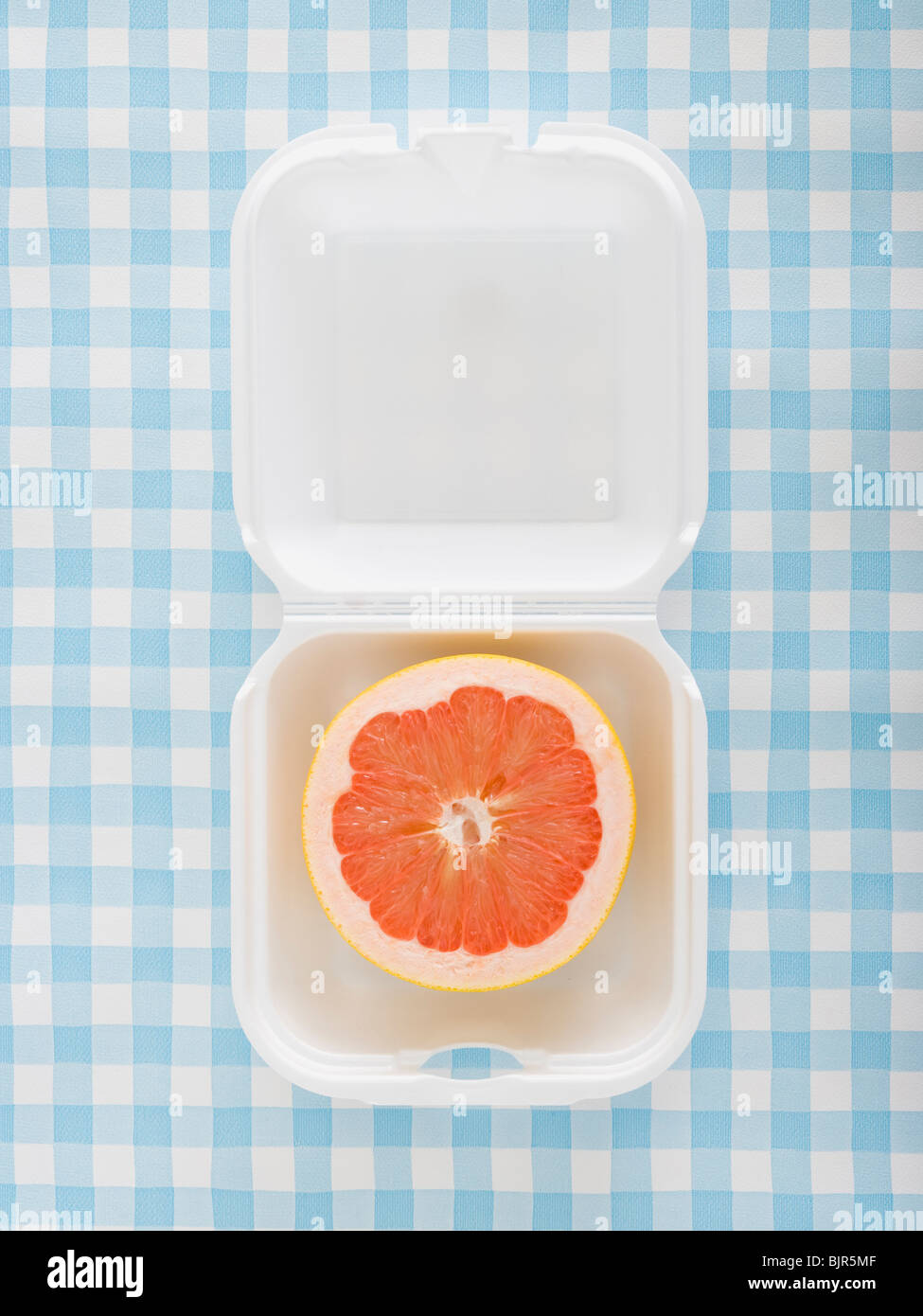 grapefruit in a fast food container Stock Photo Alamy