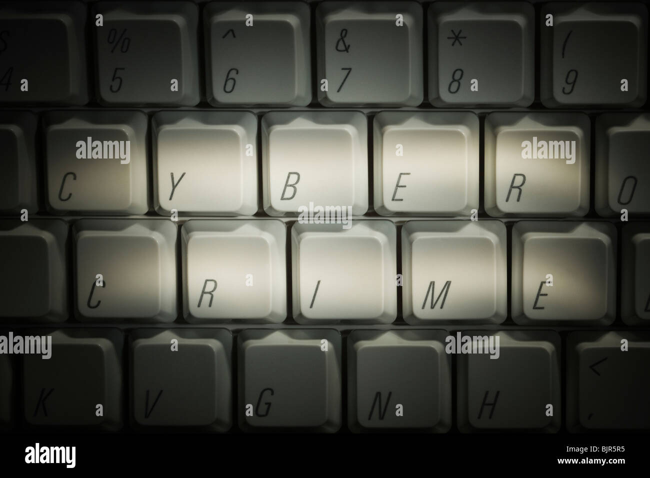 keyboard with cyber crime highlighted Stock Photo