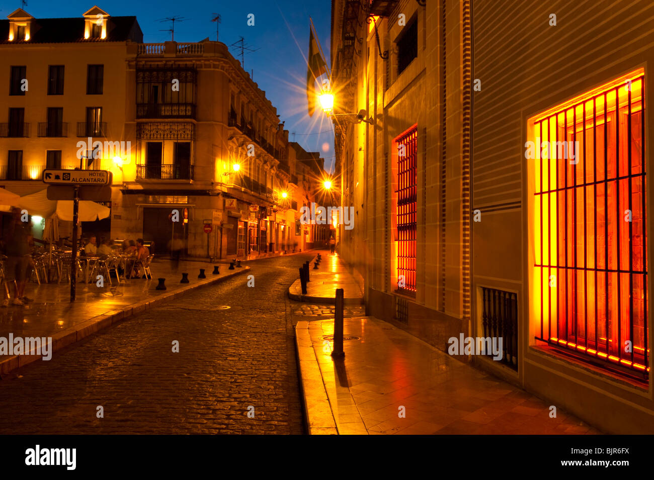 This is an image of a street at dusk in Seville, Spain. Stock Photo