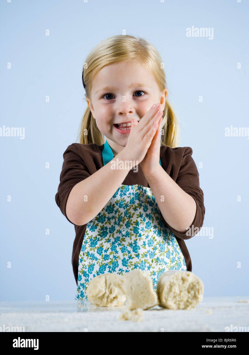 little girl kneading dough Stock Photo Alamy