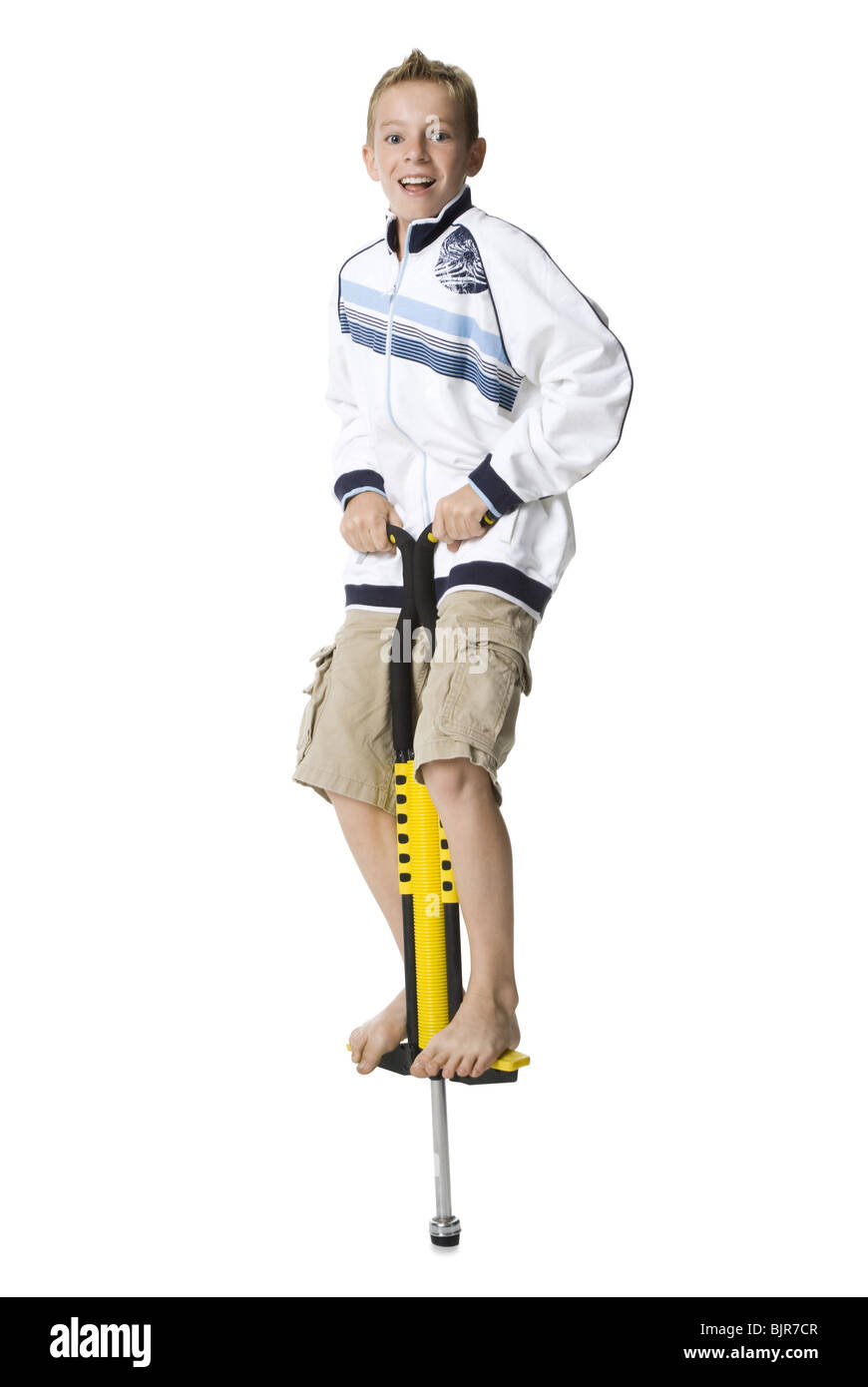 boy on a pogo stick Stock Photo