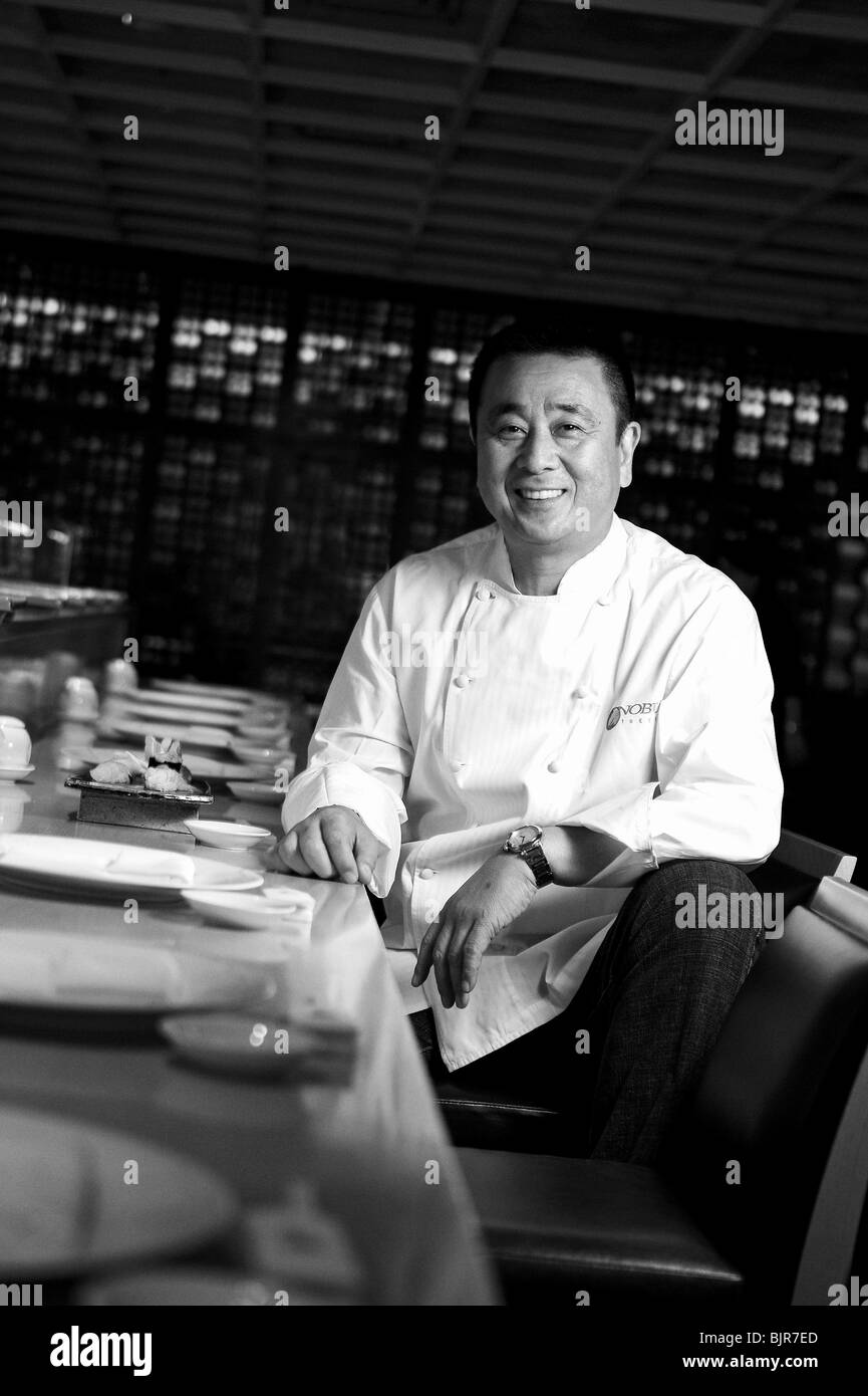 World-renowned Japanese chef Nobu Matsuhisa sits at the counter of his restaurant in central Tokyo, Japan. Stock Photo