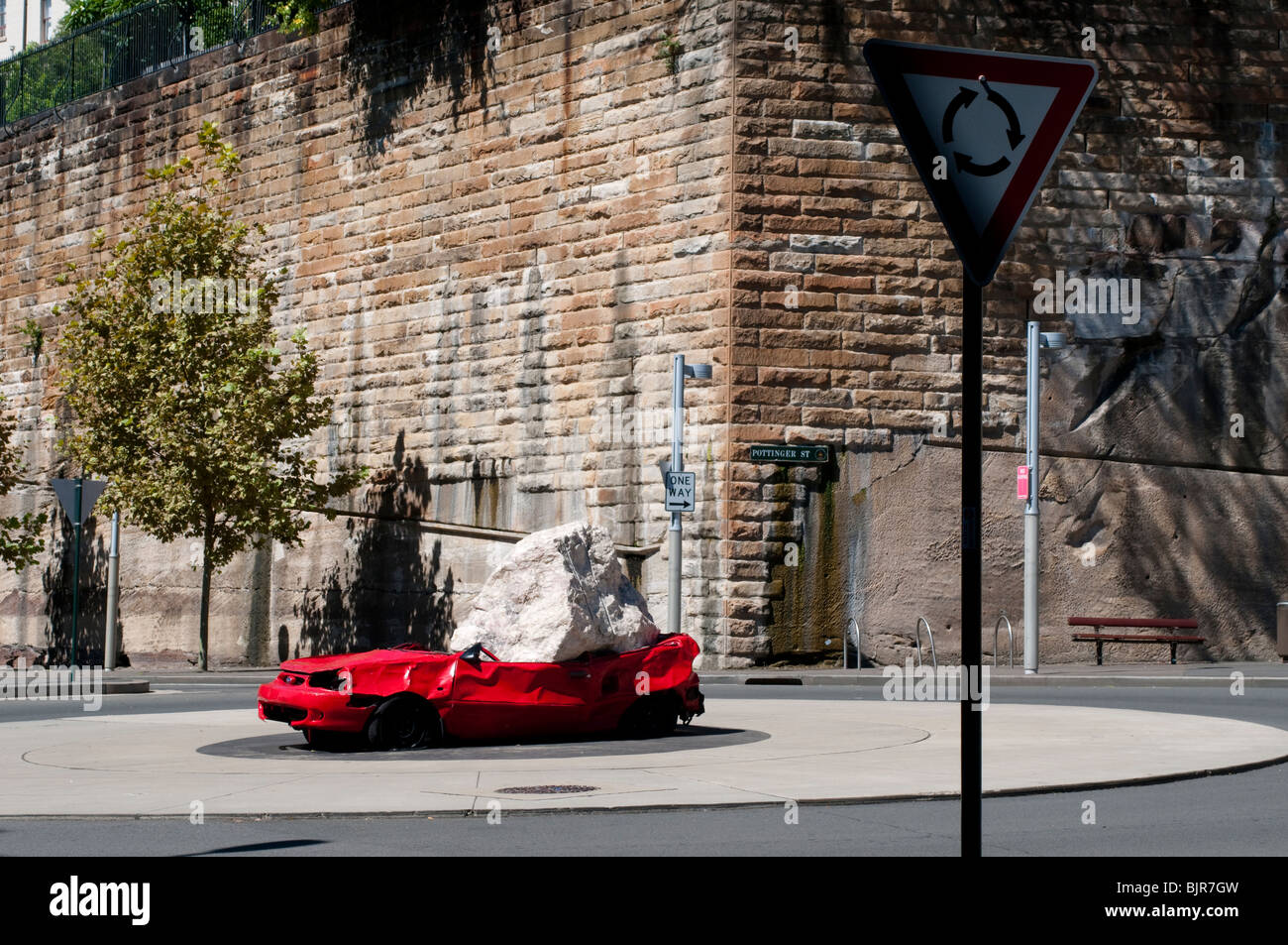 Public art showing a car smashed by a rock, the Rocks, Sydney