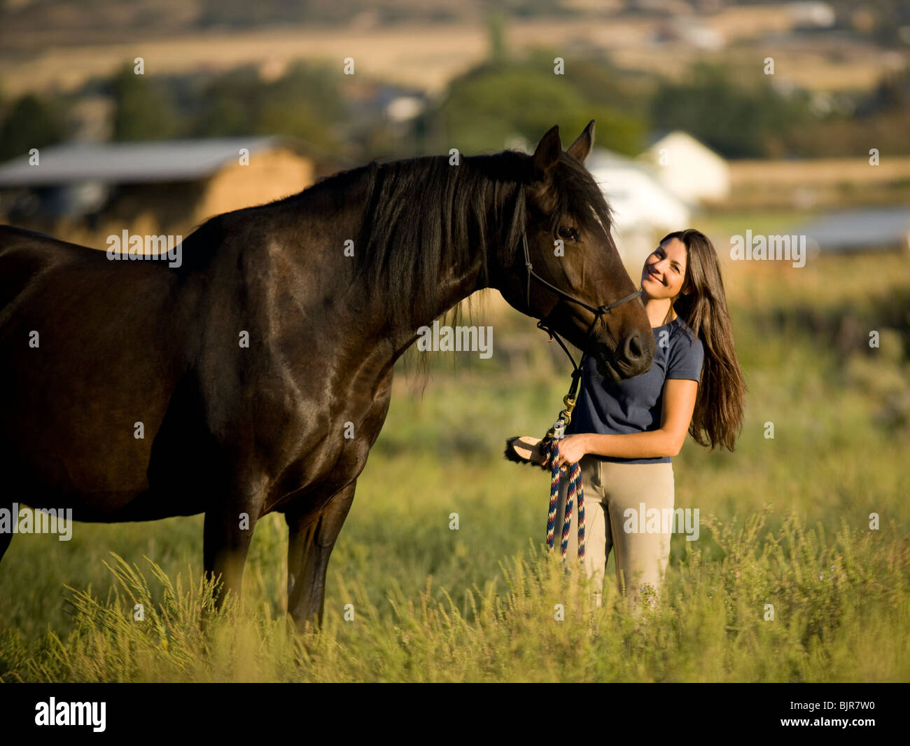 woman and a horse Stock Photo