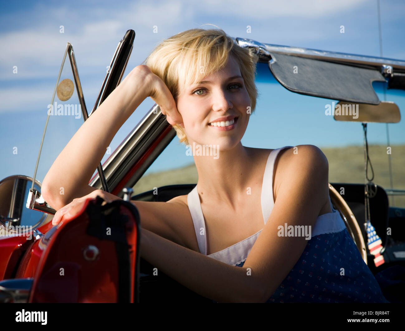 woman in a convertible Stock Photo