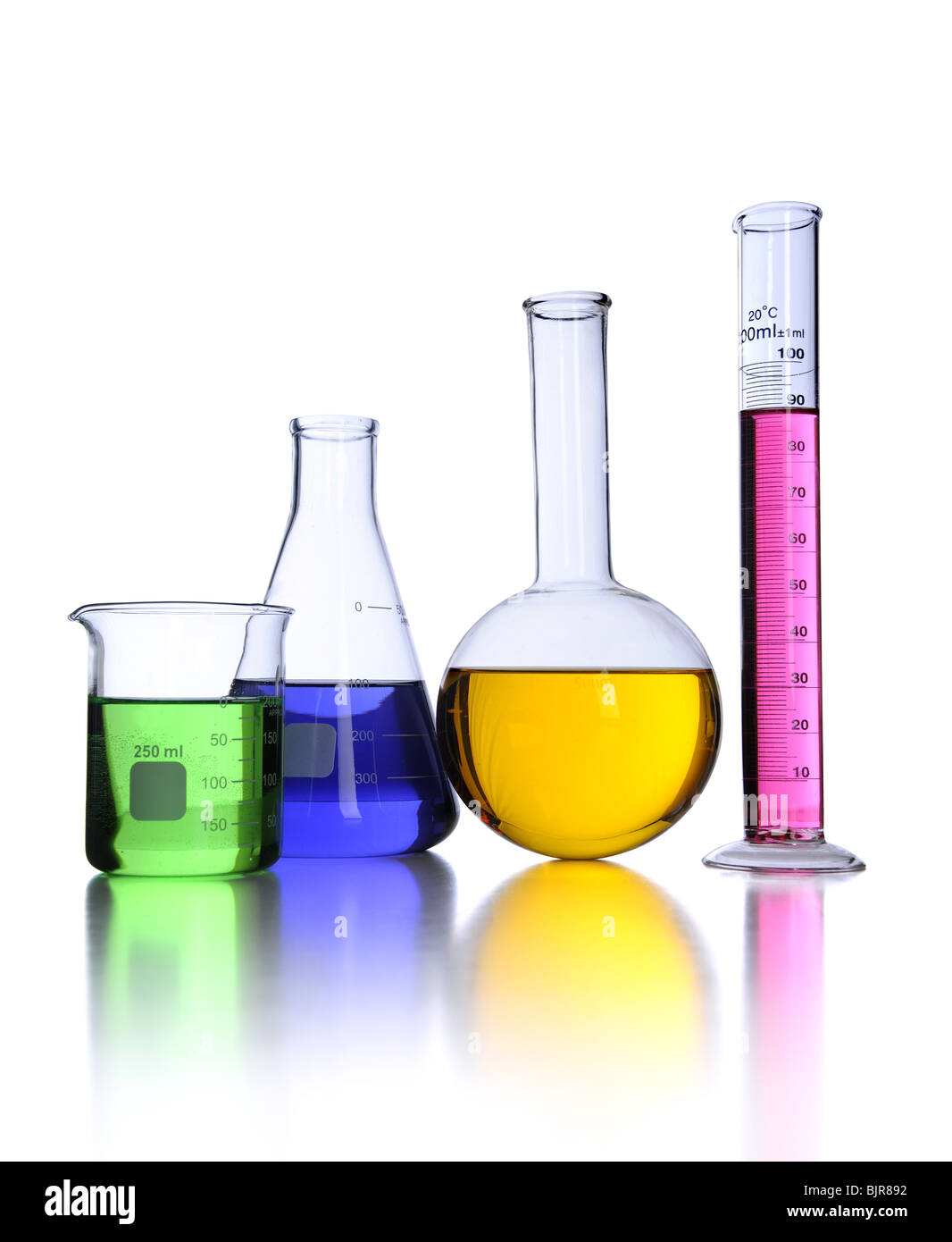 Laboratory glassware over white background with reflections on foreground Stock Photo