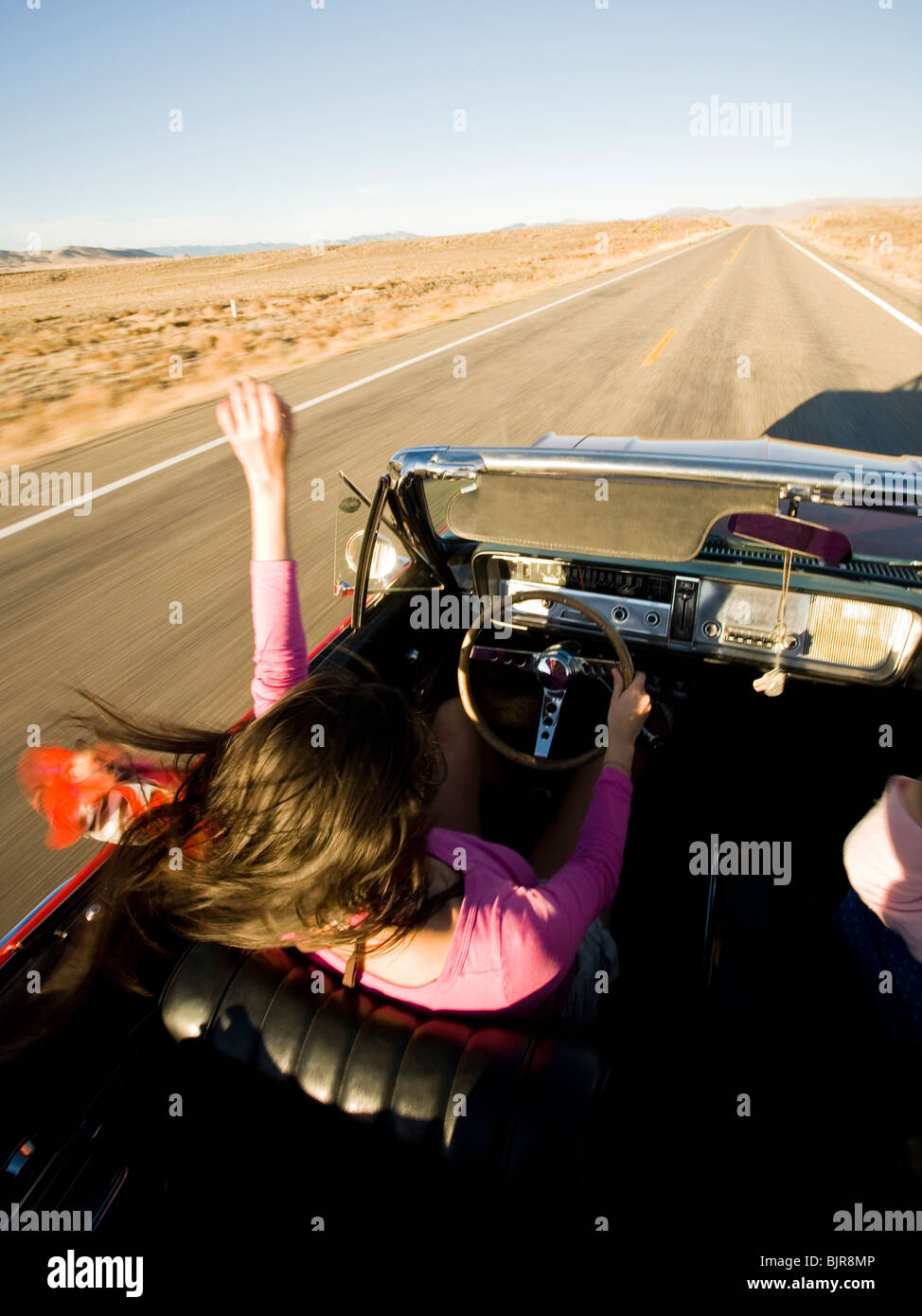 woman in a red convertible Stock Photo - Alamy