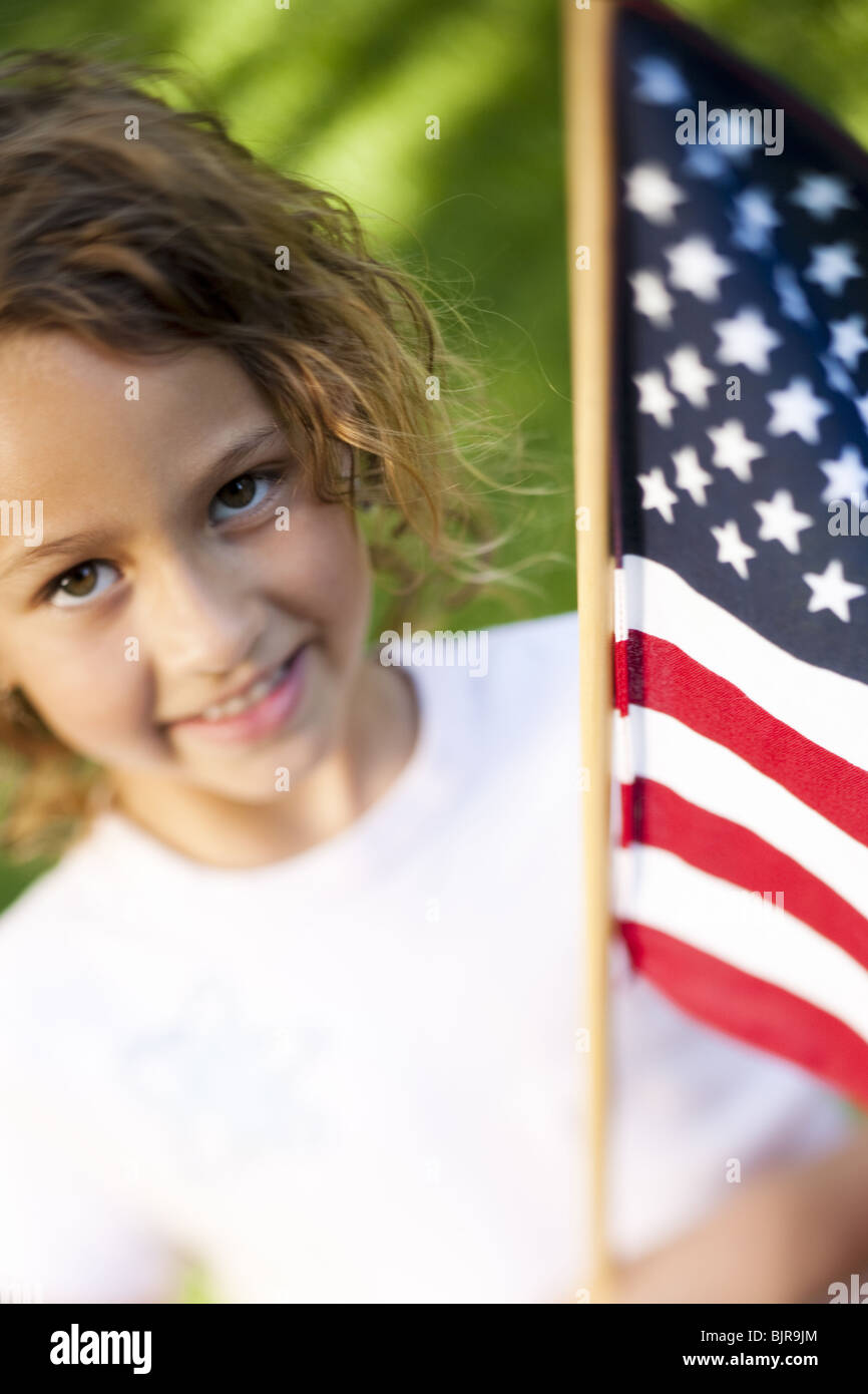 Girl holding US flag Stock Photo - Alamy