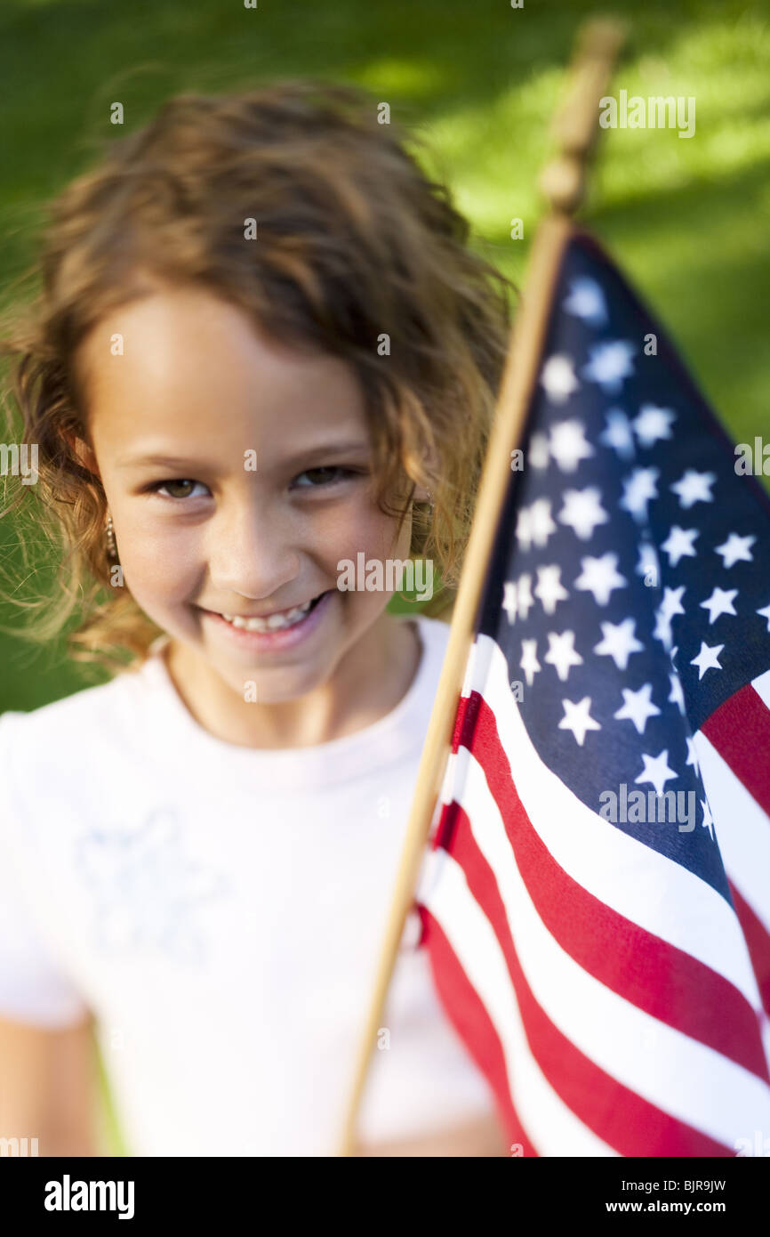 Girl holding US flag Stock Photo Alamy