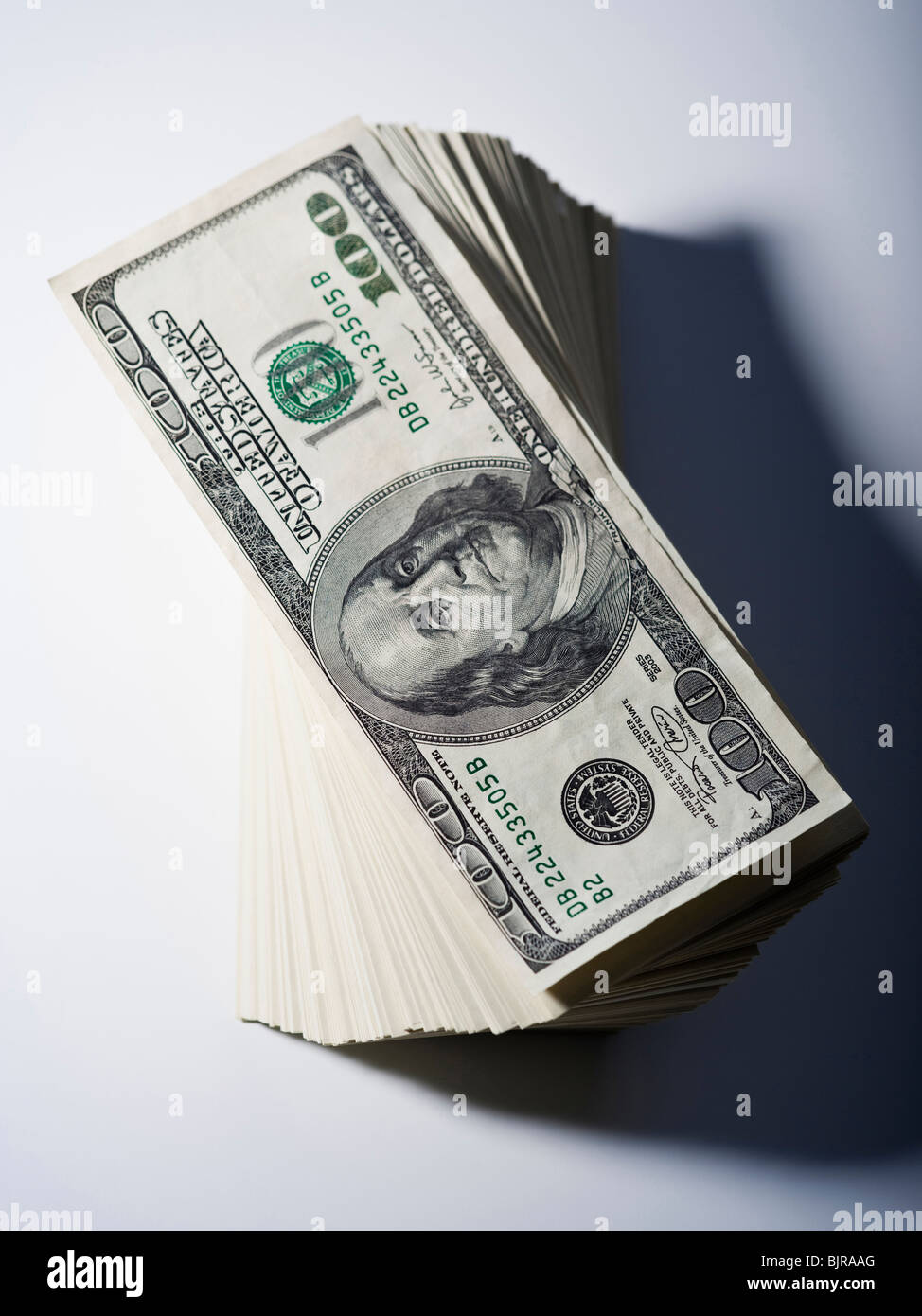 Stack of one hundred dollar bills Stock Photo