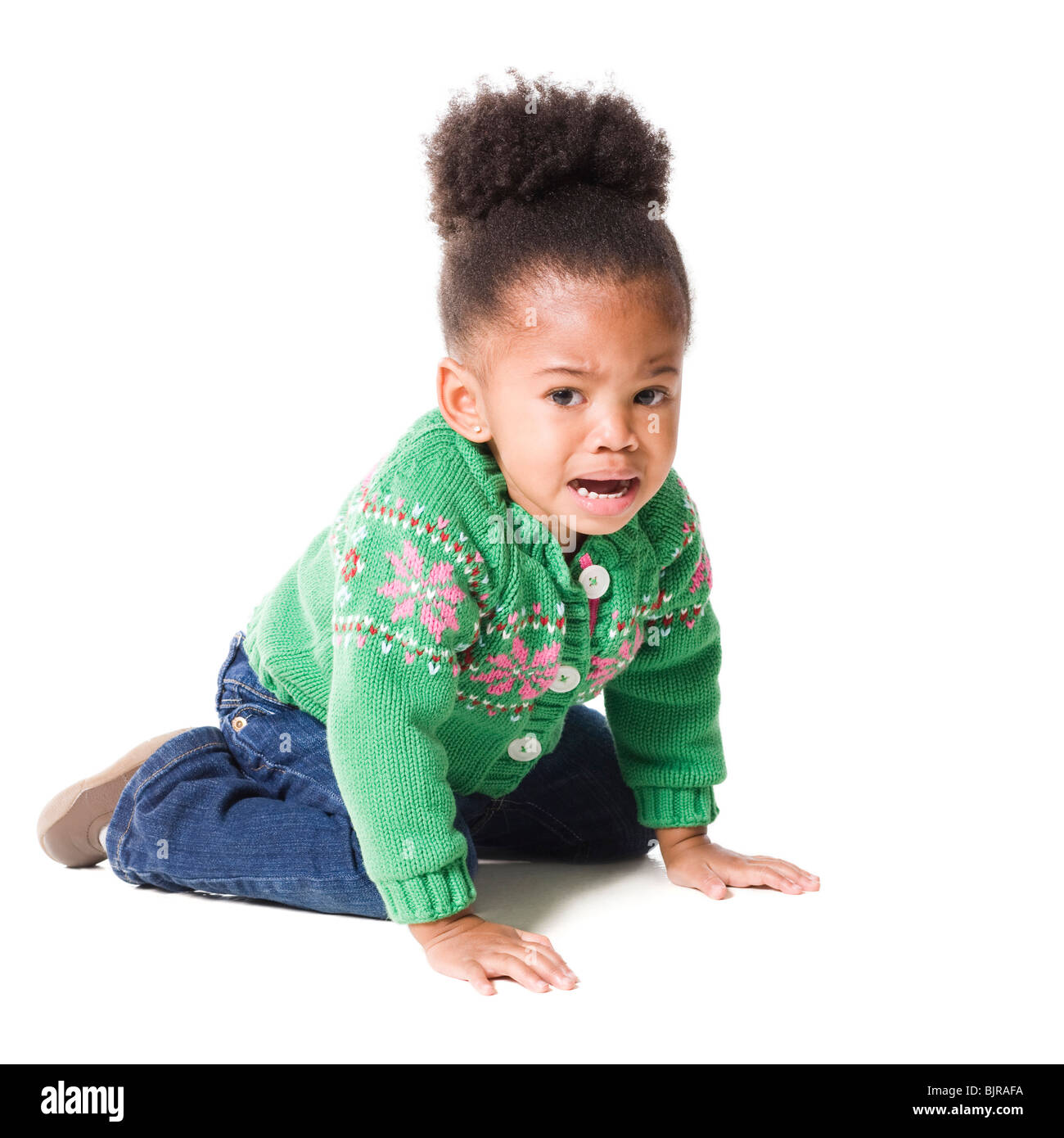 Studio portrait of baby girl (18-23 months) sulking Stock Photo