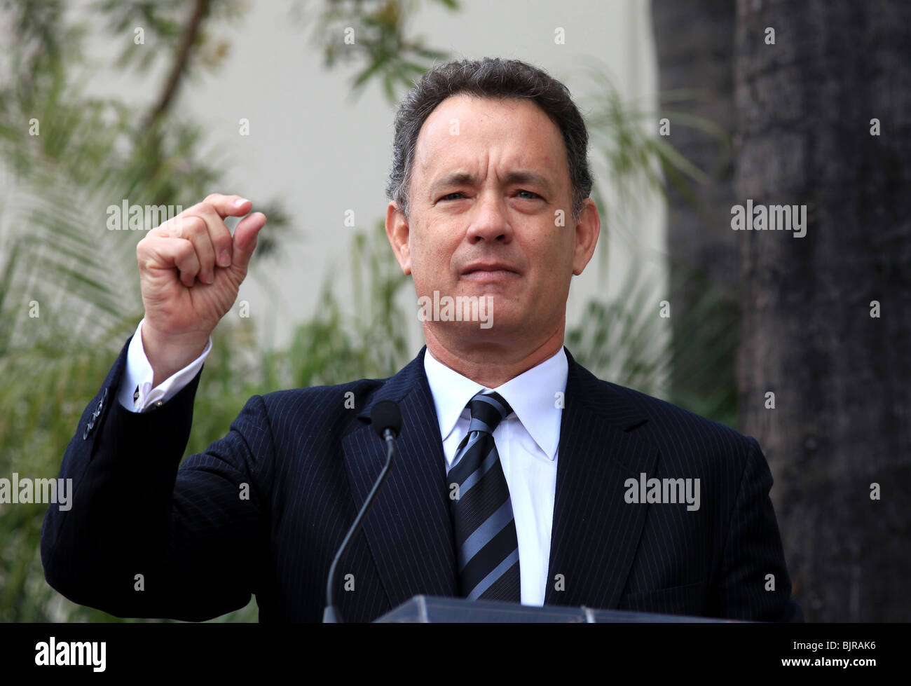 TOM HANKS GEORGE HARRISON HONORED POSTHUMOUSLY WITH A STAR ON THE HOLLYWOOD WALK OF FAME HOLLYWOOD LOS ANGELES CA USA 14 Apri Stock Photo